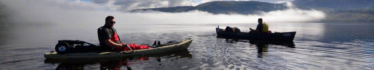 Commitment. A couple paddle on a cloudy lake