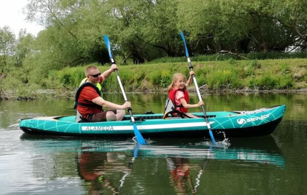 Adult and child in Kayak. Introduction to Paddlesport
